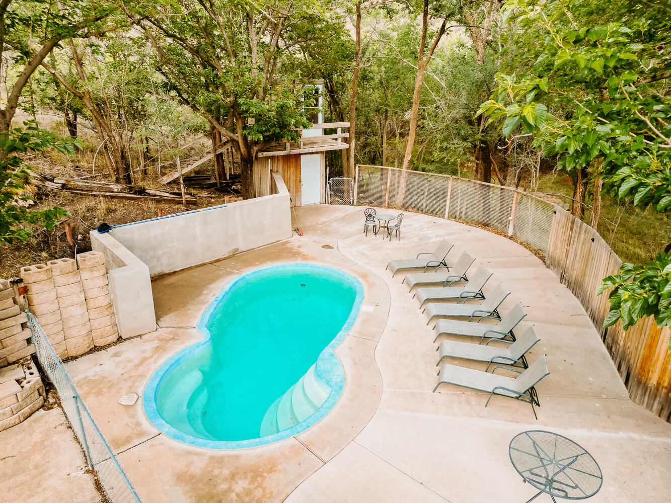 585 Comanche Drive Lubbock, TX 79404 - Photo 15 of 17 a view of a swimming pool with a patio