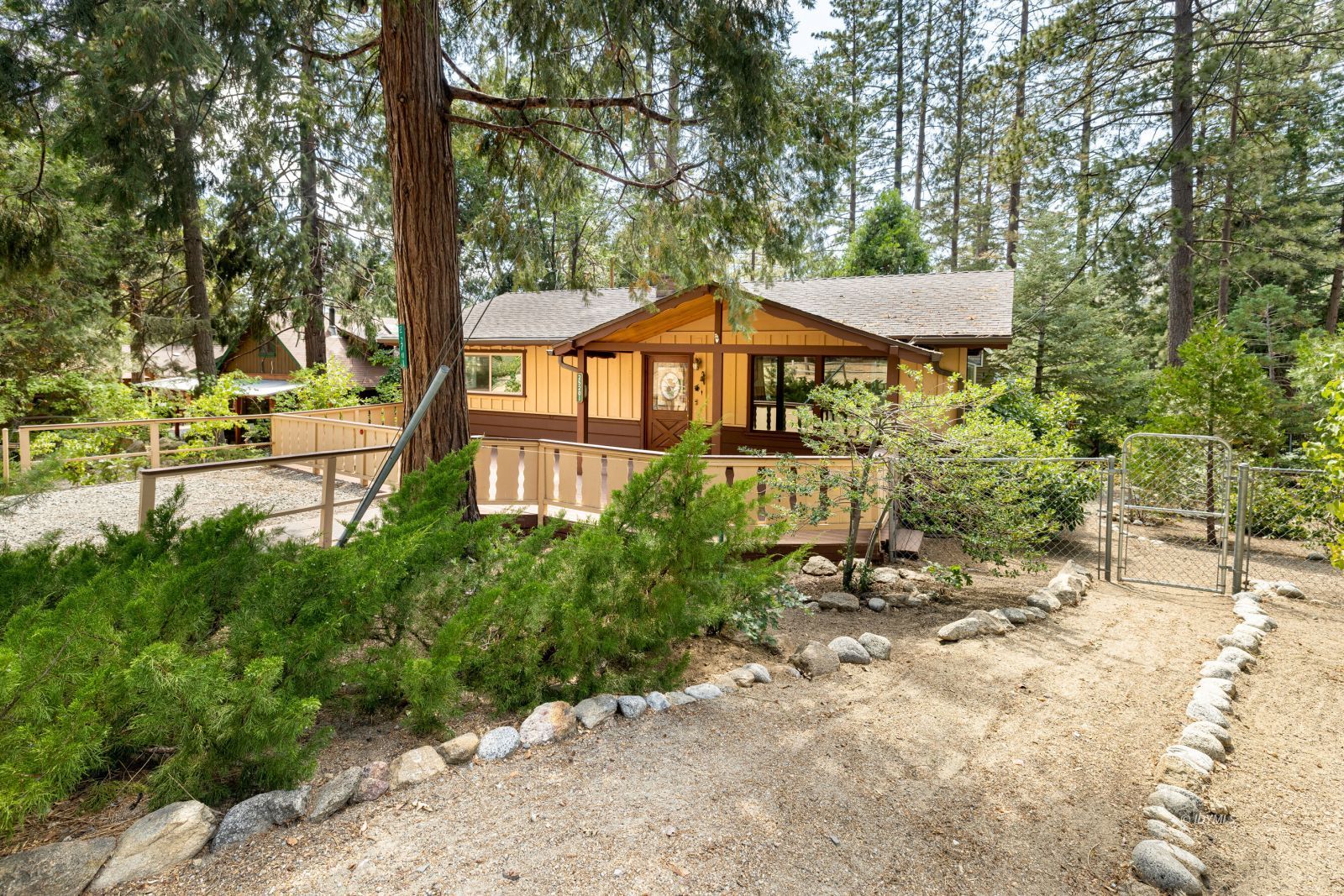 25201 Palomar Road Idyllwild, CA 92549 - Photo 1 of 18 a front view of a house with a yard