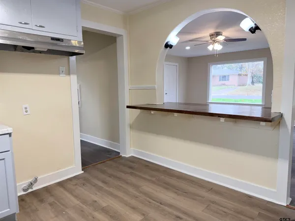 wooden floor in a kitchen with a window