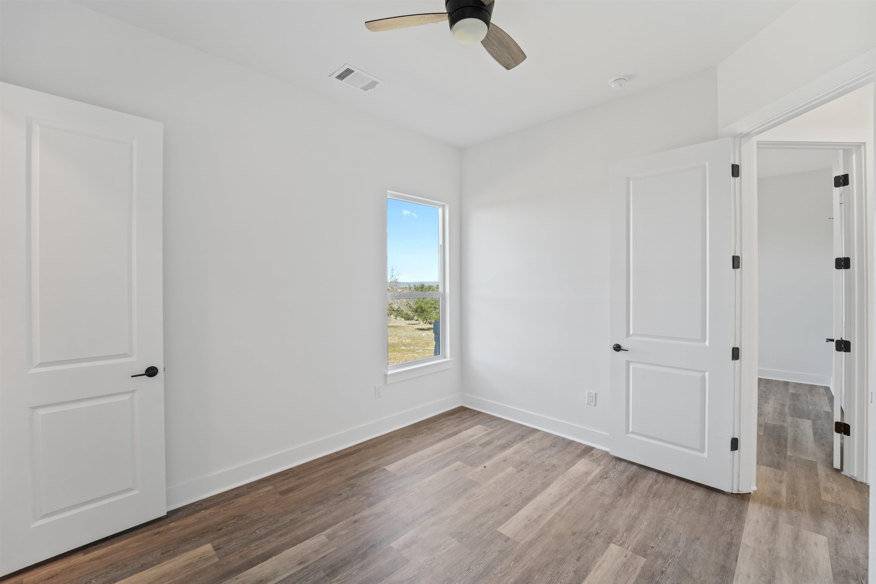 100 Up There Horseshoe Bay, TX 78657 - Photo 22 of 28 a view of an empty room with wooden floor