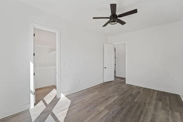 a view of room with a ceiling fan