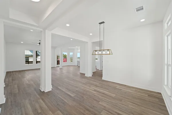 a view of a room with wooden floor