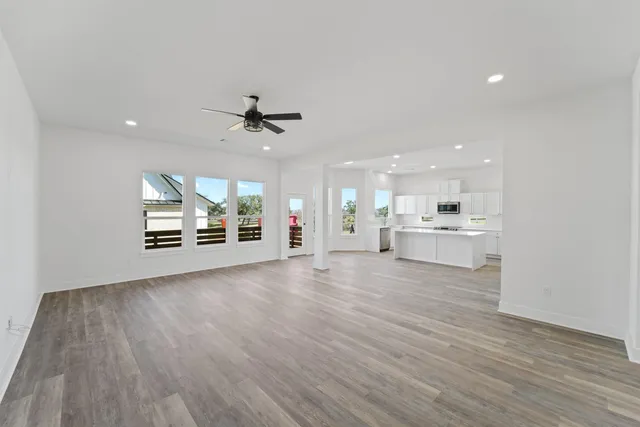 a view of a kitchen with a sink and a stove top oven