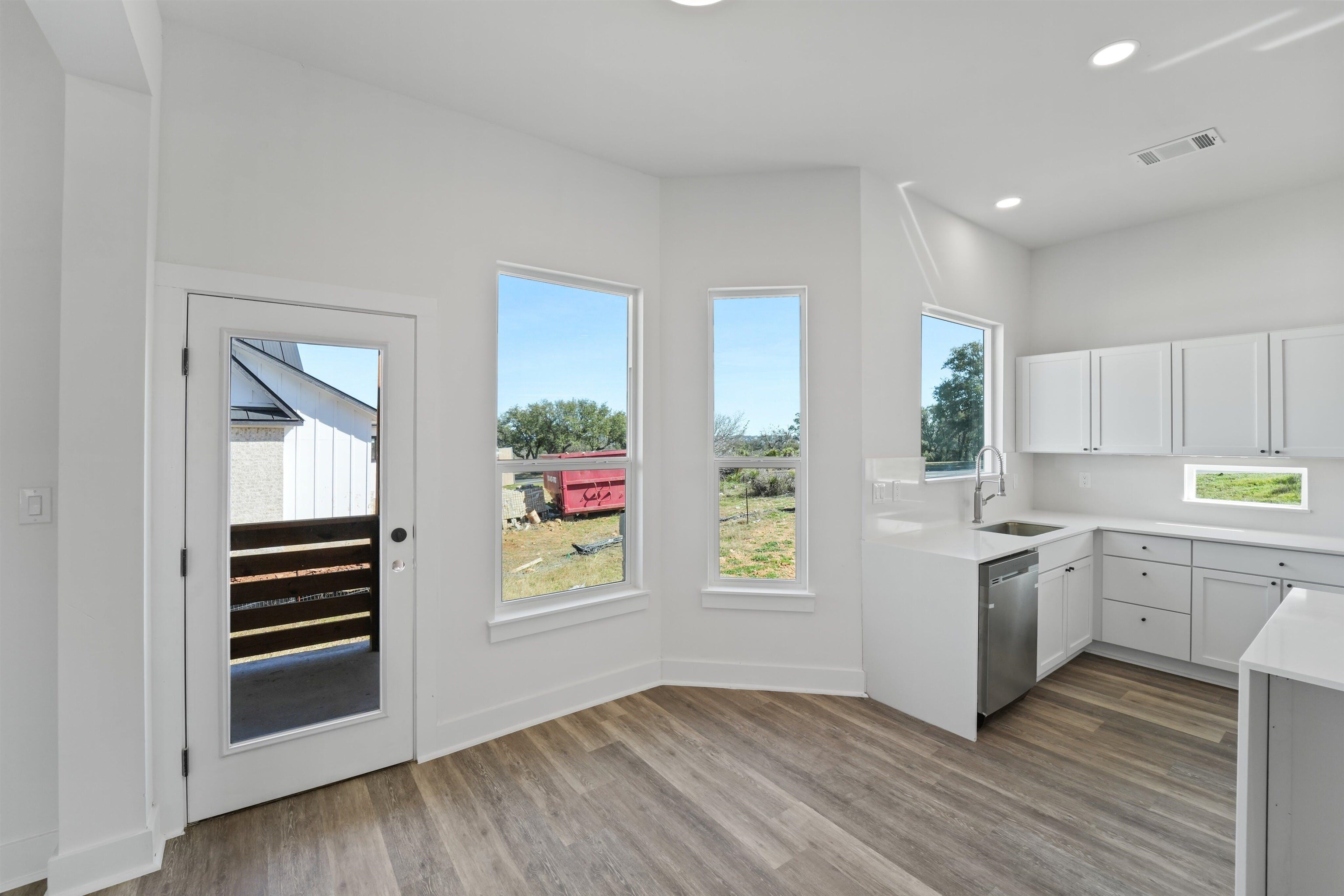 100 Up There Horseshoe Bay, TX 78657 - Photo 9 of 28 a kitchen with a refrigerator and a stove top oven