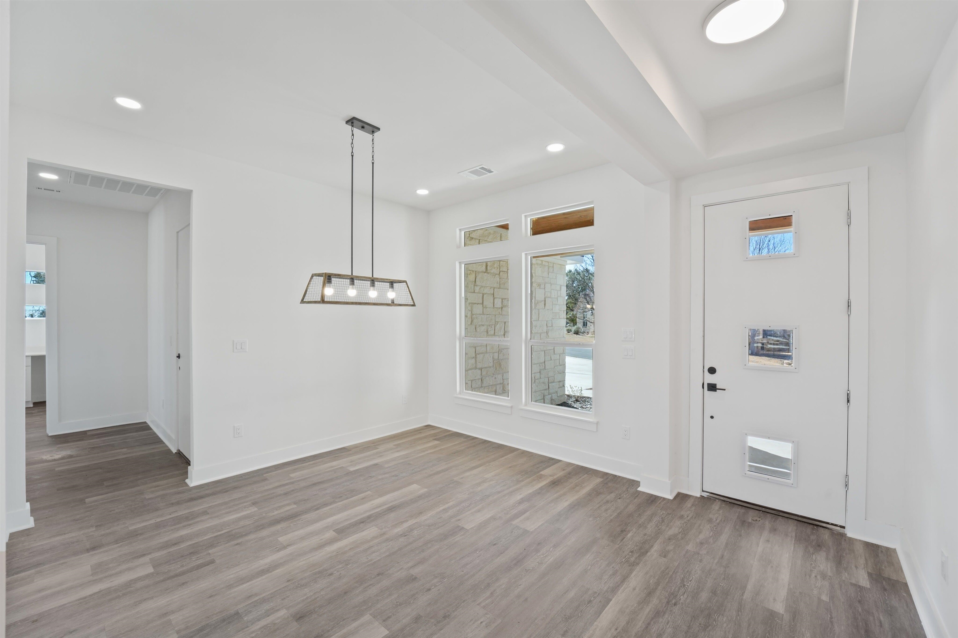 100 Up There Horseshoe Bay, TX 78657 - Photo 10 of 28 a view of an empty room with wooden floor and a window