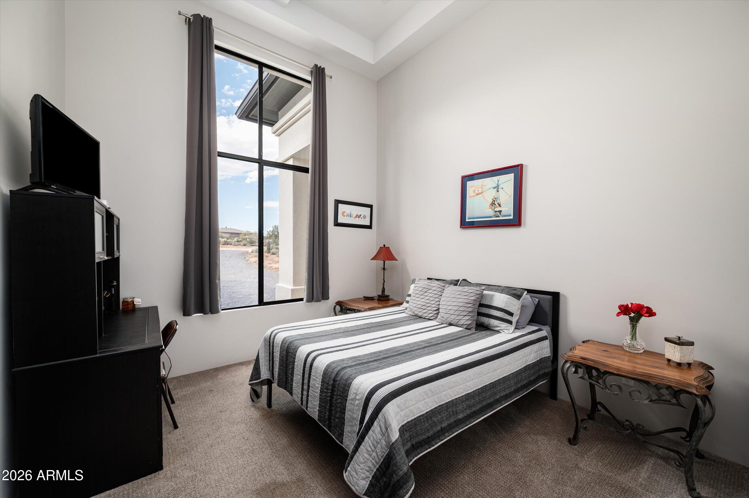 17439 East Wildcat Drive Rio Verde, AZ 85263 - Photo 11 of 25 a bedroom with a bed and a flat screen tv