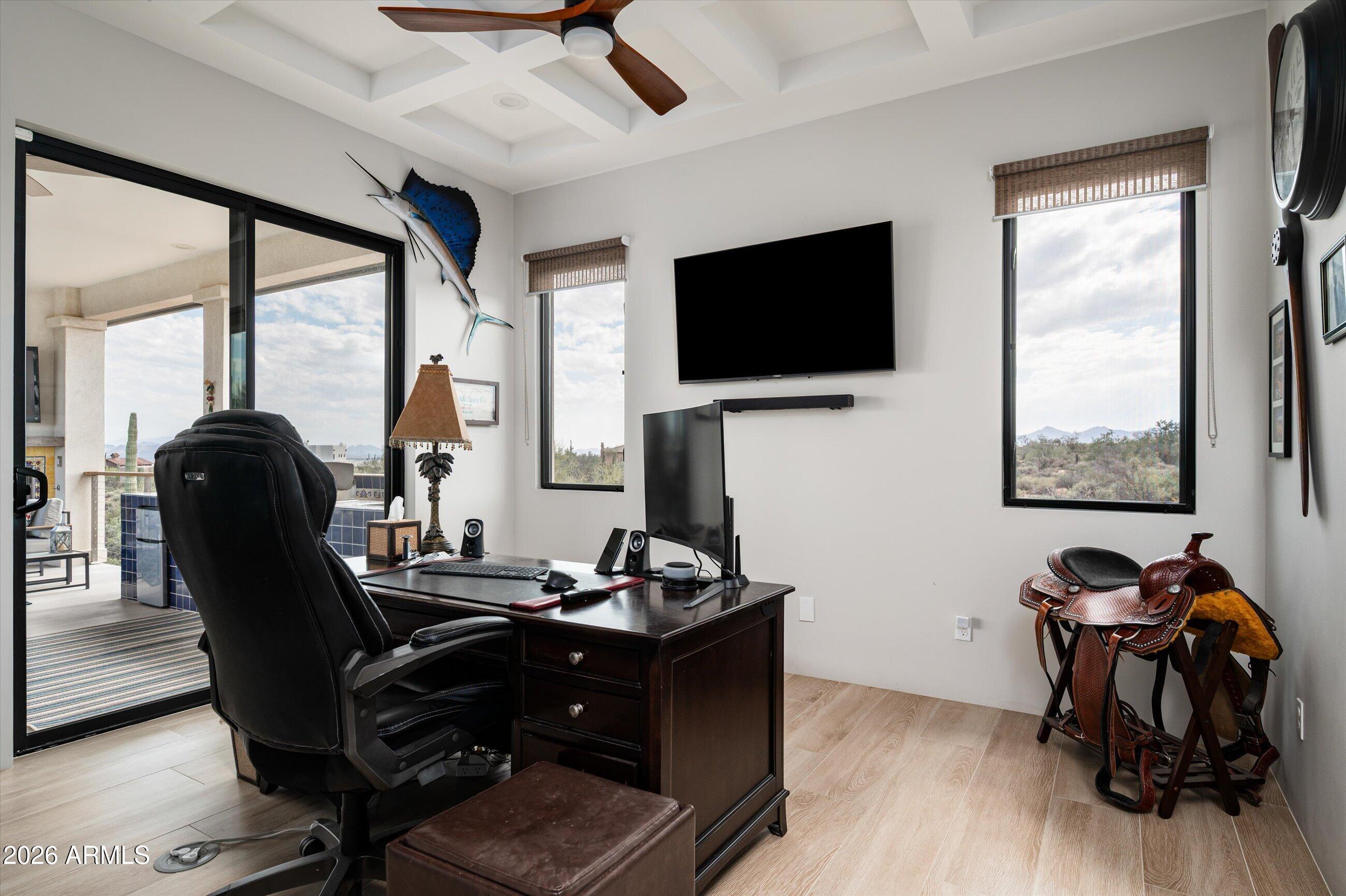 17439 East Wildcat Drive Rio Verde, AZ 85263 - Photo 14 of 25 a view of a workspace with furniture and a flat screen tv