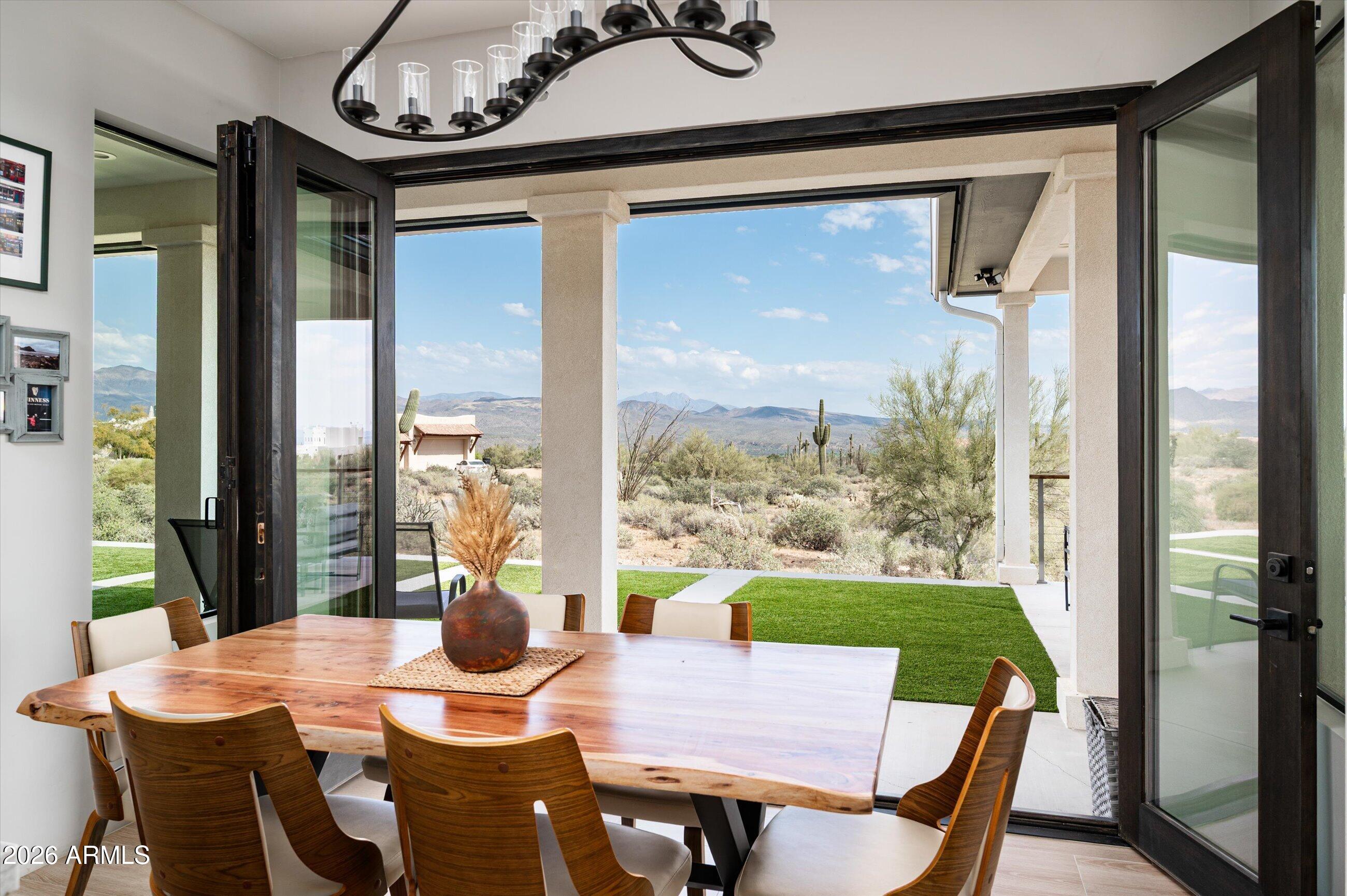 17439 East Wildcat Drive Rio Verde, AZ 85263 - Photo 7 of 25 a view of a dining room with furniture window and wooden floor
