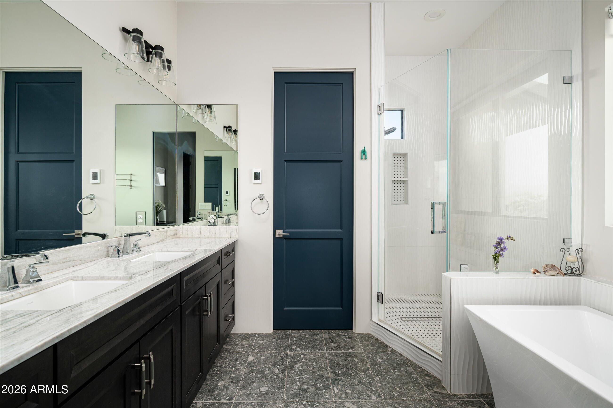 17439 East Wildcat Drive Rio Verde, AZ 85263 - Photo 9 of 25 a spacious bathroom with a bathtub sink double and mirror