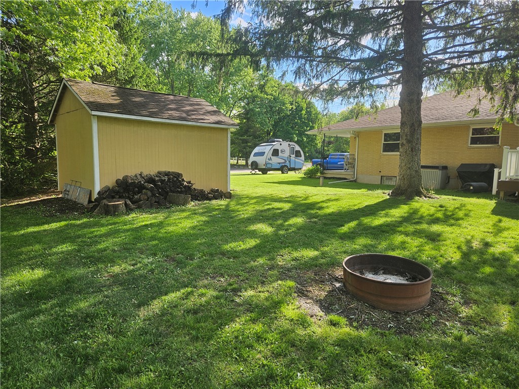 3998 Willowcrest Road Beavercreek, OH 45430 - Photo 6 of 41 This spacious yard features a practical shed and a fire pit, perfect for outdoor enjoyment.