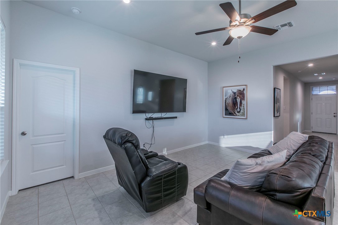 908 Coriander Road Temple, TX 76501 - Photo 4 of 28 a living room with furniture and a flat screen tv