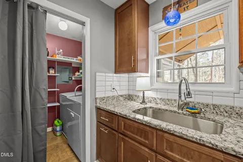 a kitchen with a sink and a window