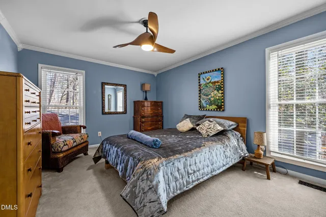 a kitchen with stainless steel appliances granite countertop a refrigerator a stove and a sink with wooden floor