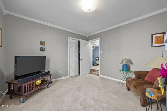 a livingroom with furniture and a flat screen tv