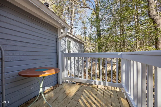 a living room with furniture a fireplace and a table