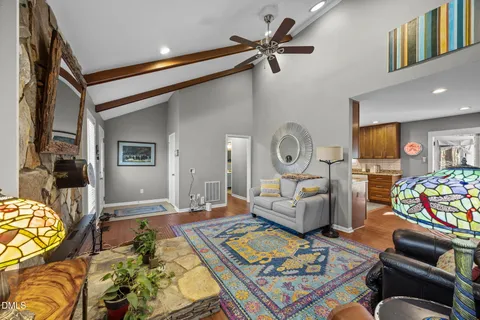 a living room with furniture and wooden floor