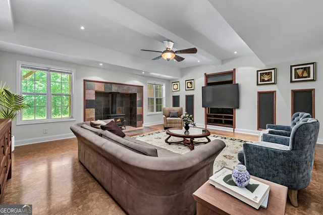 a living room with furniture and a flat screen tv