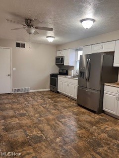 3864 School House Road Little Hocking, OH 45742 - Photo 3 of 10 Kitchen with white cabinetry, ceiling fan, range with electric stovetop, a textured ceiling, and fridge