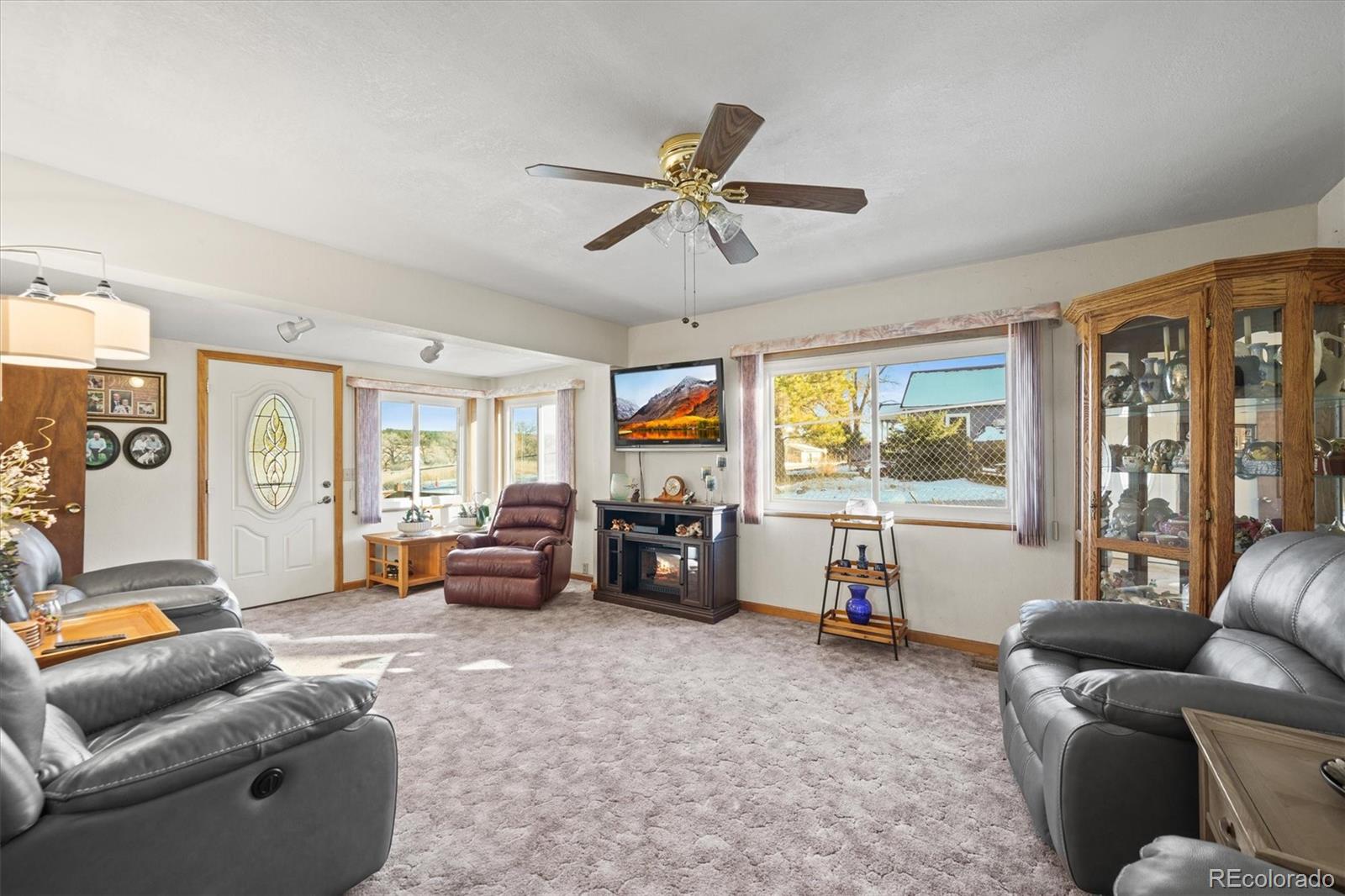 577 Main Street Elizabeth, CO 80107 - Photo 11 of 50 a living room with furniture and a flat screen tv with wooden floor