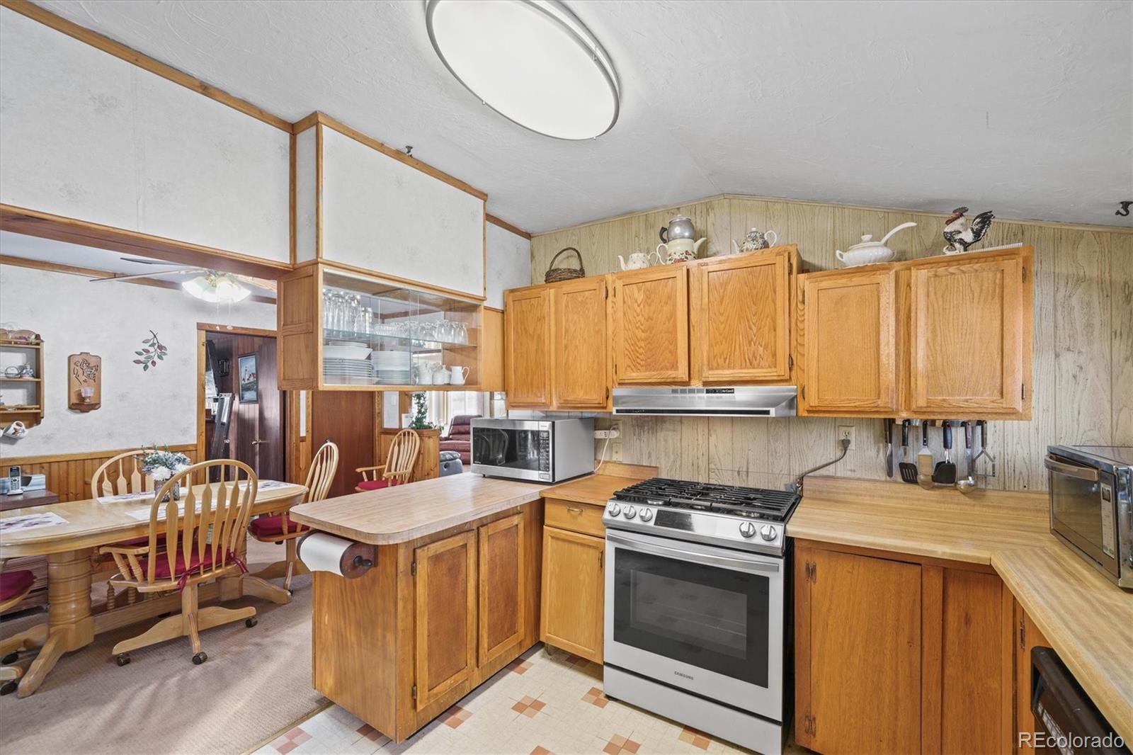 577 Main Street Elizabeth, CO 80107 - Photo 13 of 50 a kitchen that has a lot of cabinets in it