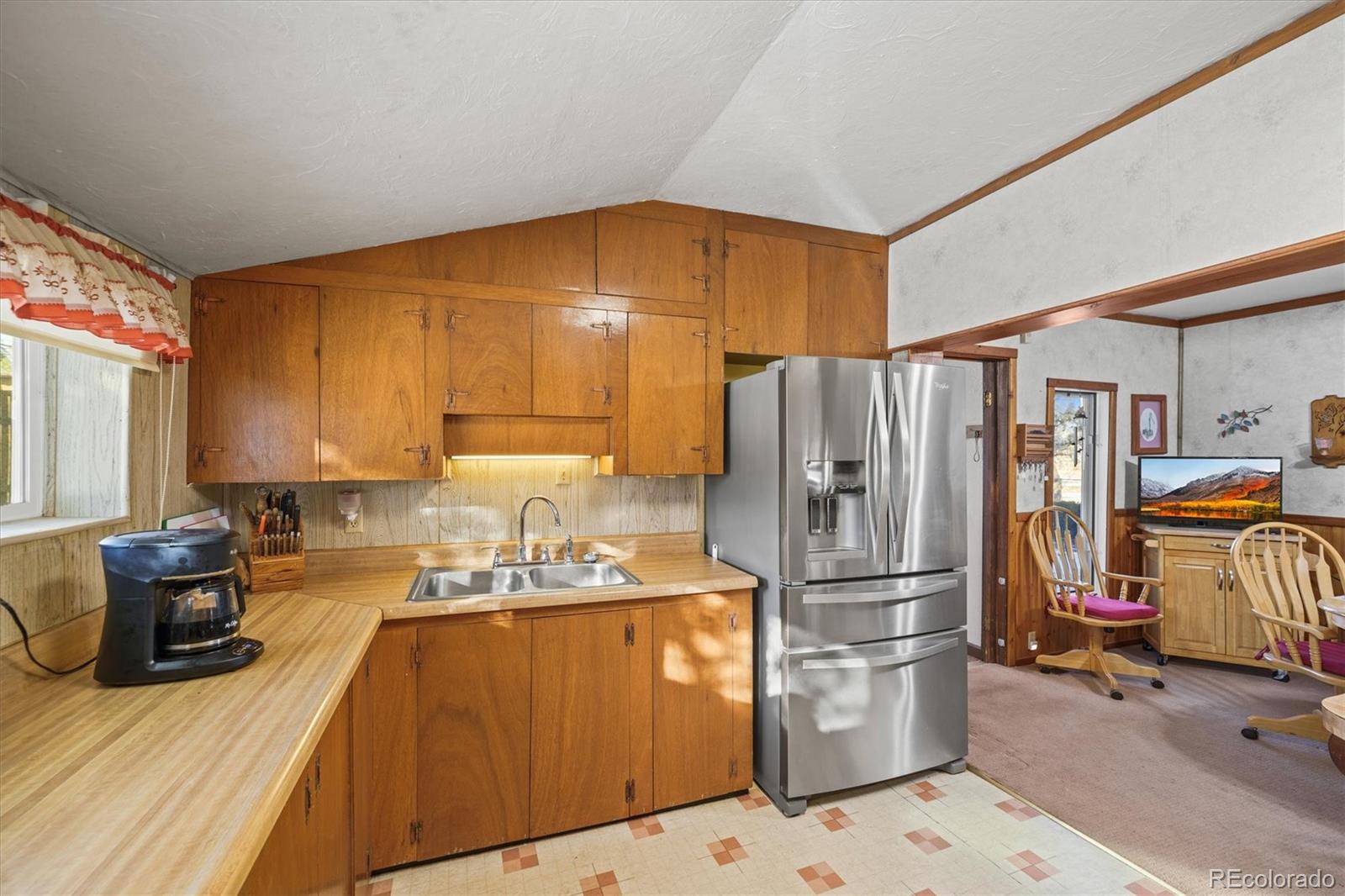 577 Main Street Elizabeth, CO 80107 - Photo 15 of 50 a kitchen with stainless steel appliances granite countertop a refrigerator and a sink