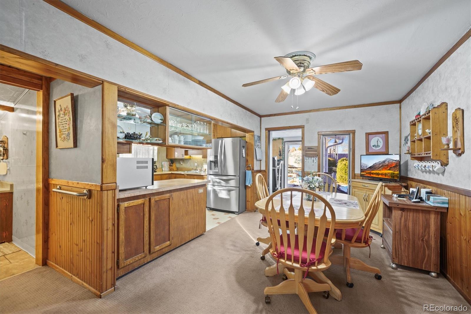 577 Main Street Elizabeth, CO 80107 - Photo 16 of 50 a view of a dining room with furniture window and wooden floor