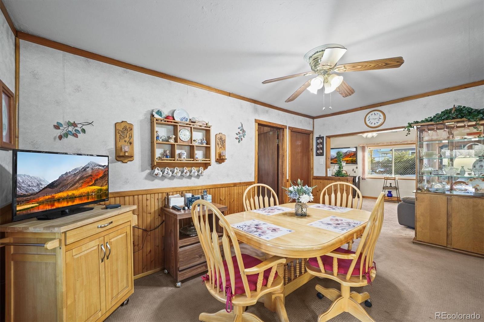 577 Main Street Elizabeth, CO 80107 - Photo 17 of 50 a view of a dining room with furniture and a chandelier