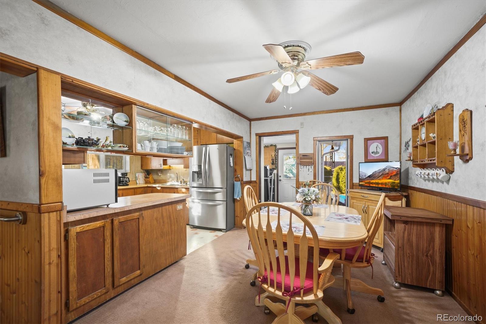 577 Main Street Elizabeth, CO 80107 - Photo 18 of 50 a view of a dining room with furniture window and wooden floor