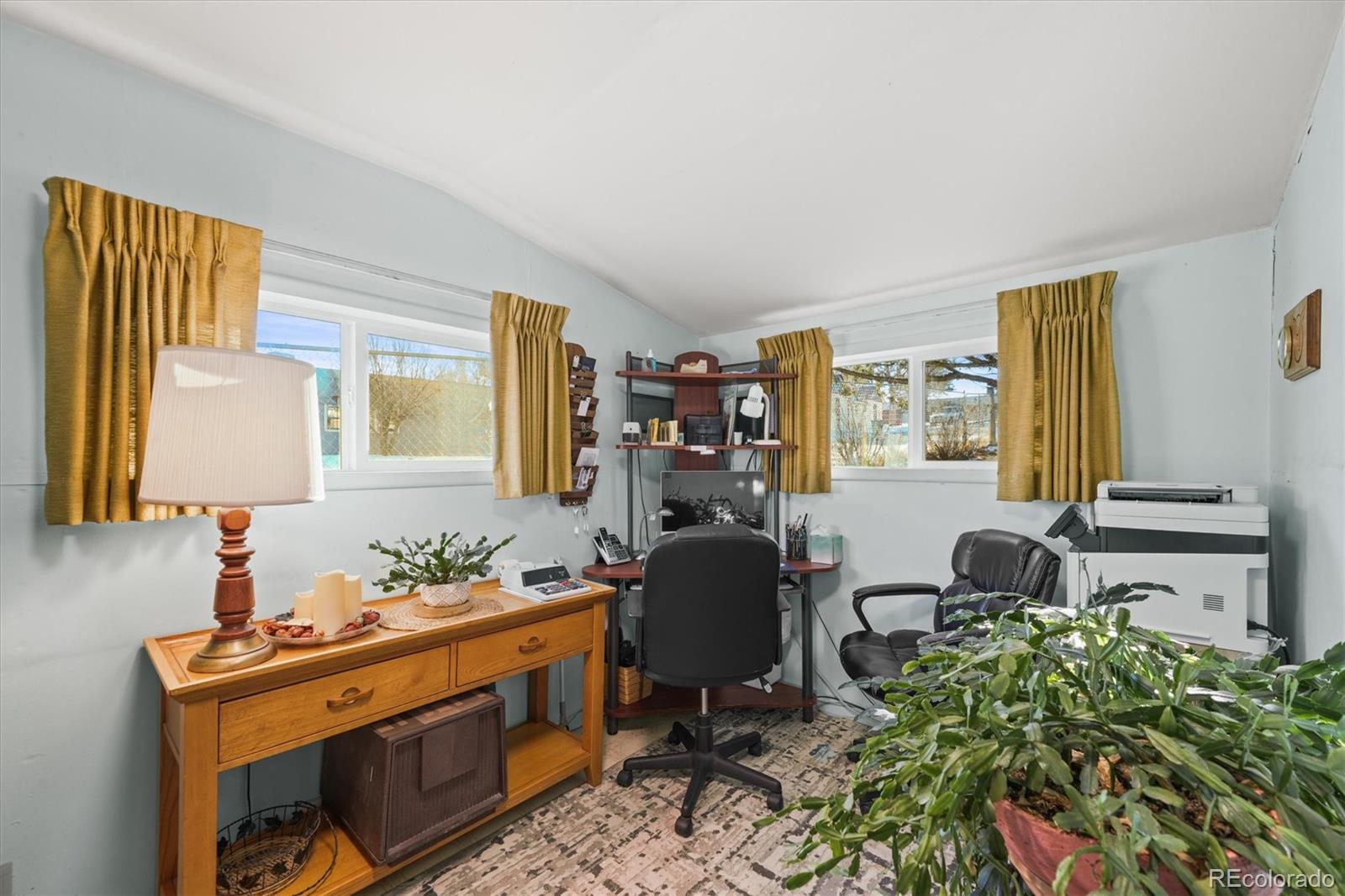 577 Main Street Elizabeth, CO 80107 - Photo 23 of 50 a view of a workspace with furniture and a window