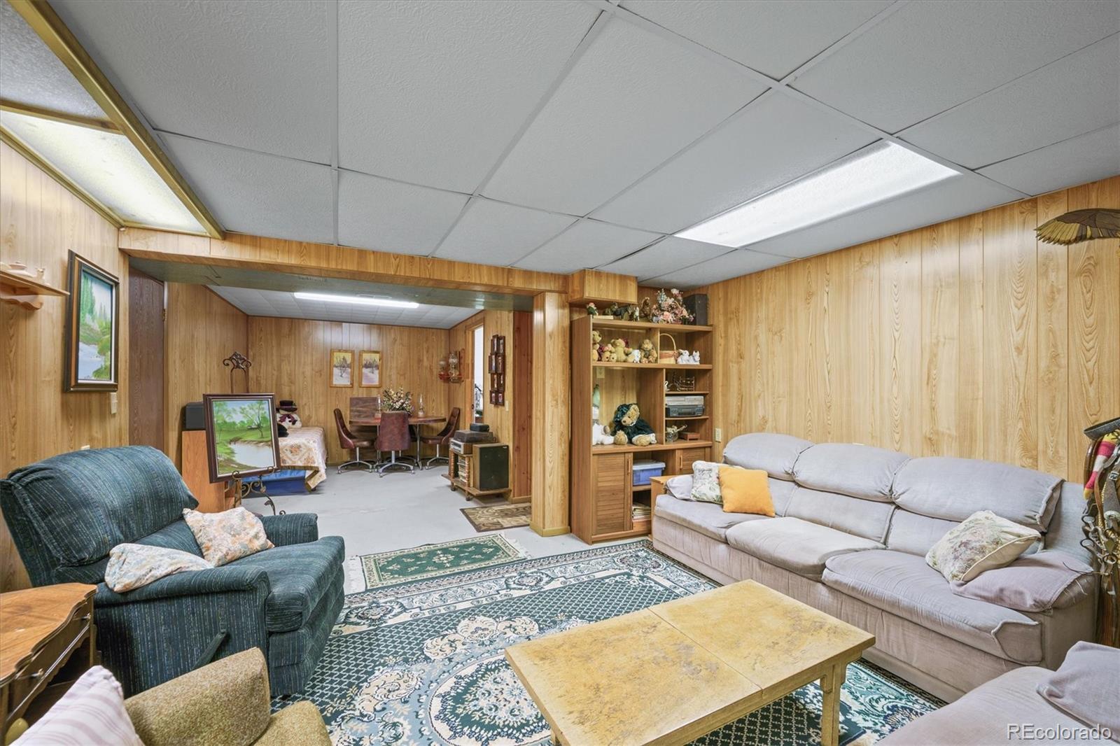 577 Main Street Elizabeth, CO 80107 - Photo 34 of 50 a living room with furniture and a large window