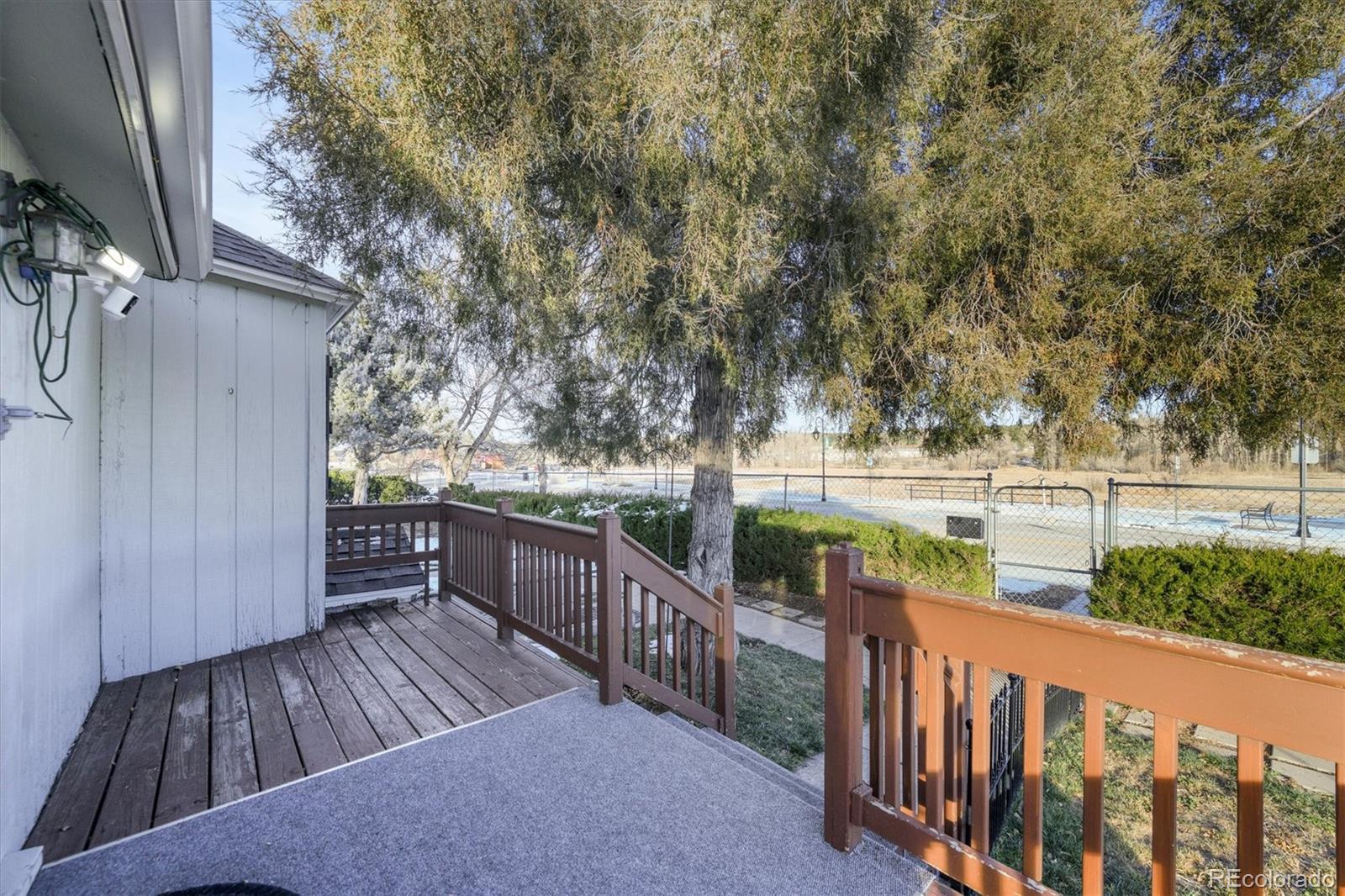 577 Main Street Elizabeth, CO 80107 - Photo 38 of 50 a view of balcony with wooden floor and fence