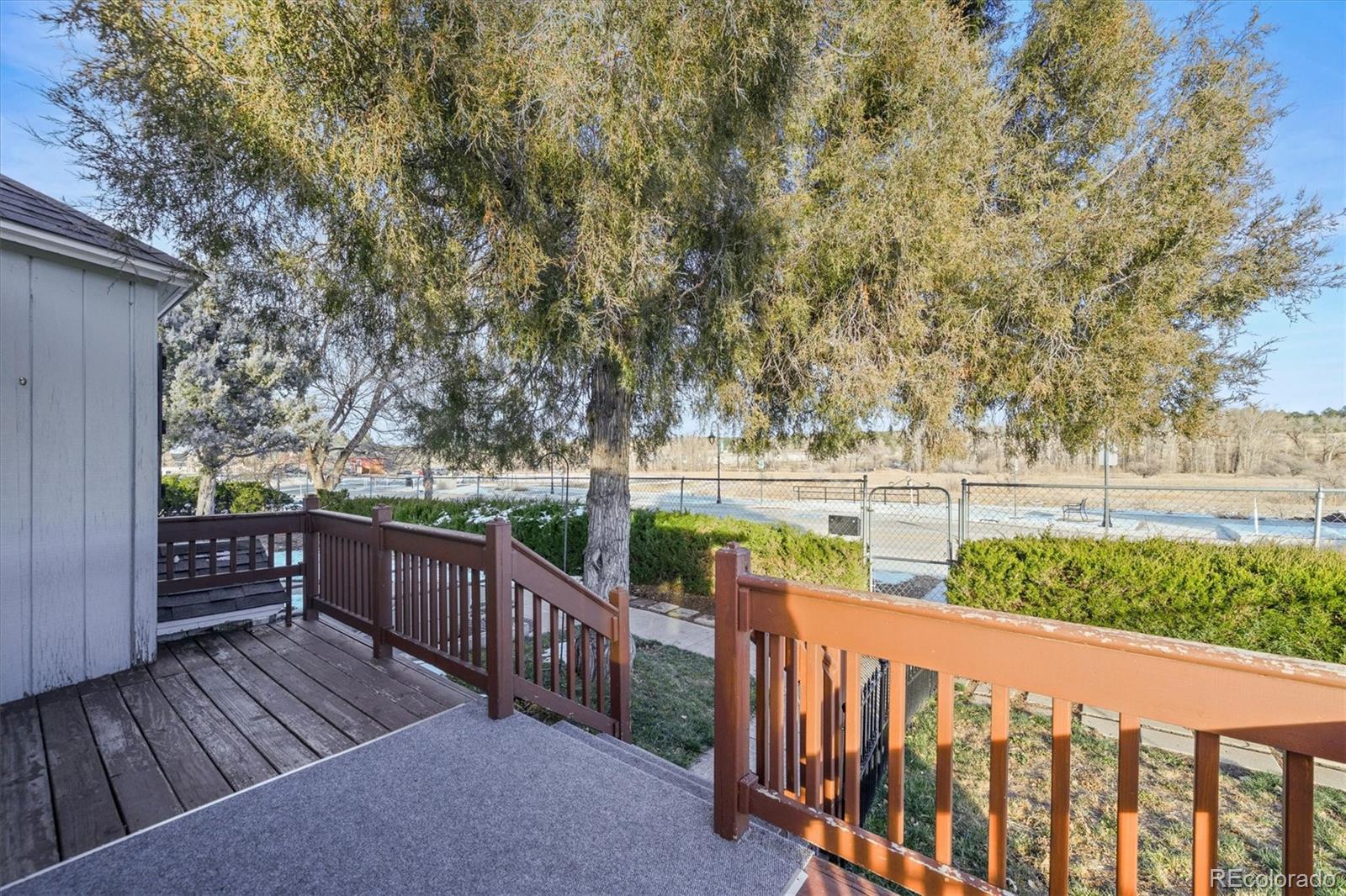 577 Main Street Elizabeth, CO 80107 - Photo 5 of 50 a balcony with wooden floor and fence