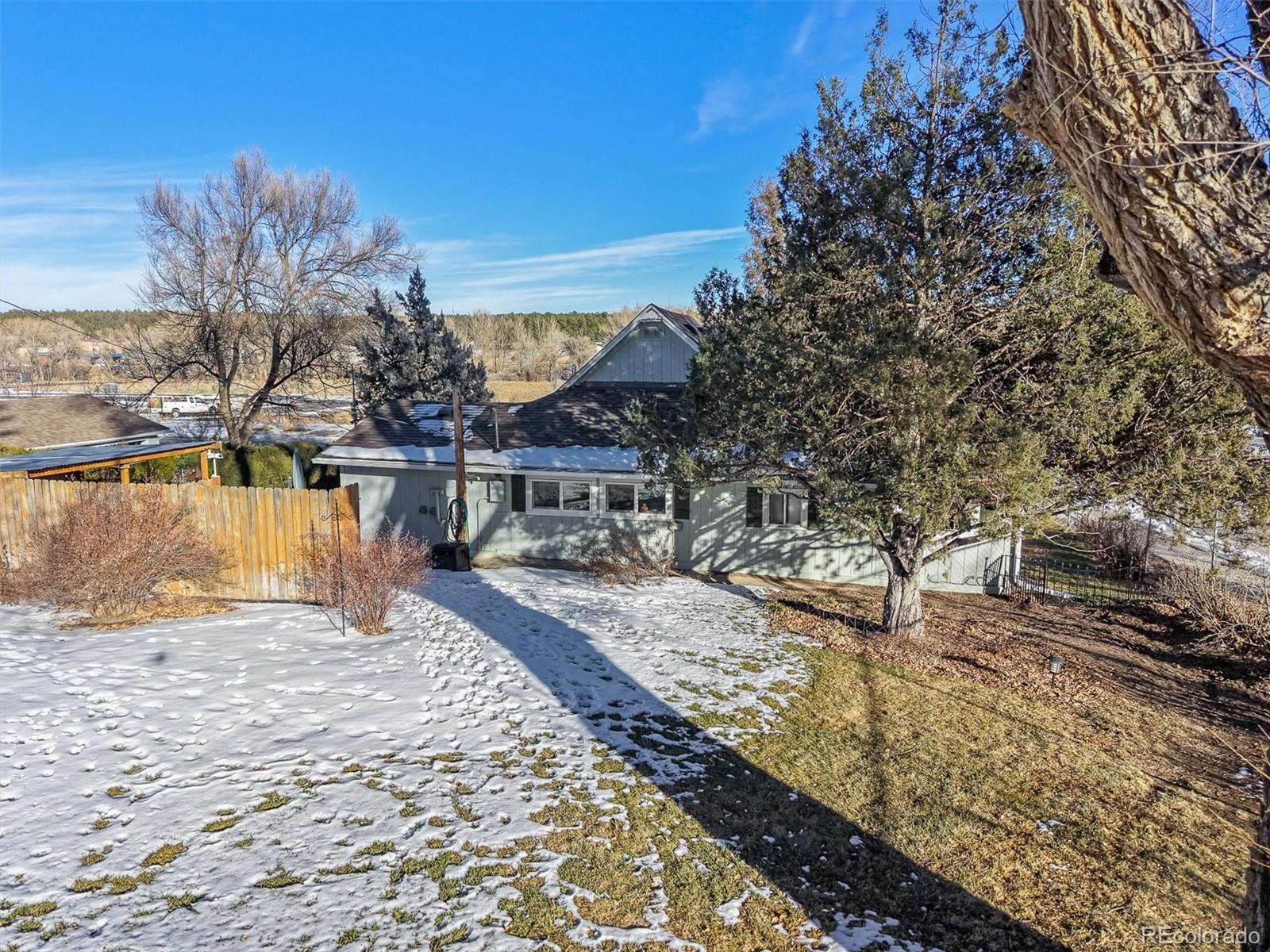 577 Main Street Elizabeth, CO 80107 - Photo 7 of 50 a view of a houses with trees