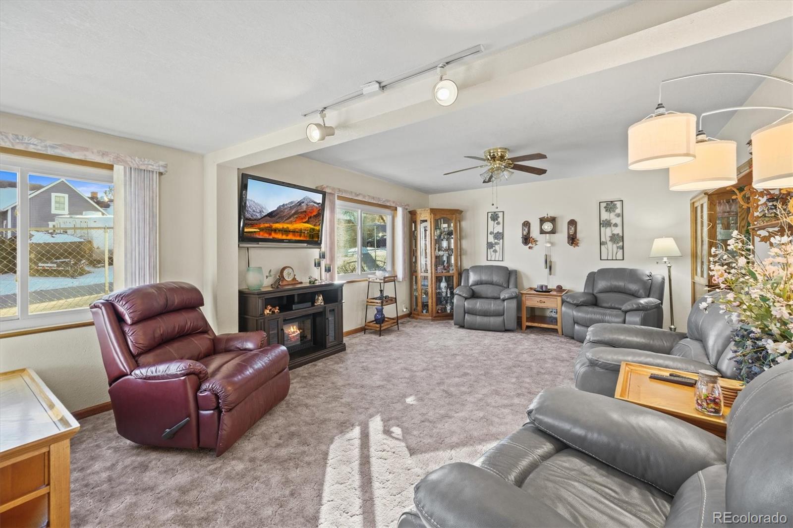 577 Main Street Elizabeth, CO 80107 - Photo 10 of 50 a living room with furniture large window and flat screen tv