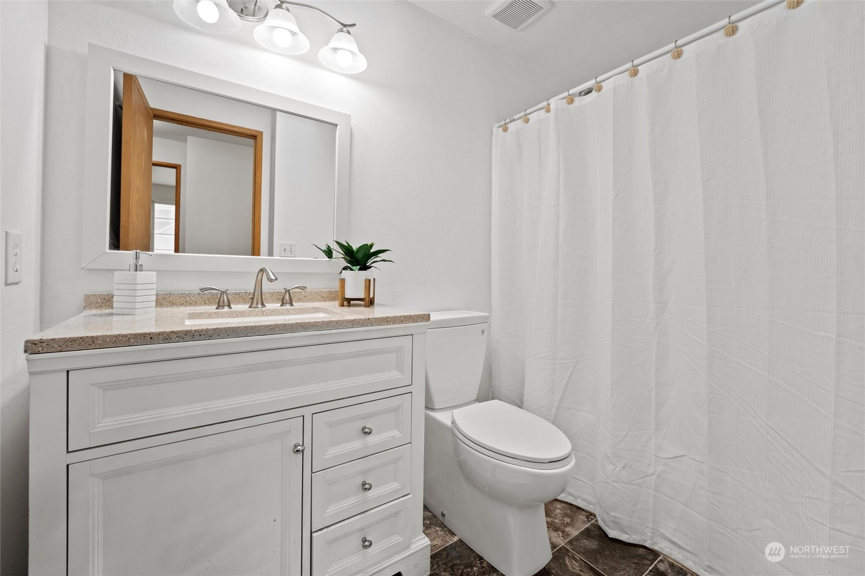 4574 Knute Anderson Road Northwest Silverdale, WA 98383 - Photo 13 of 39 a bathroom with a sink a toilet and a mirror
