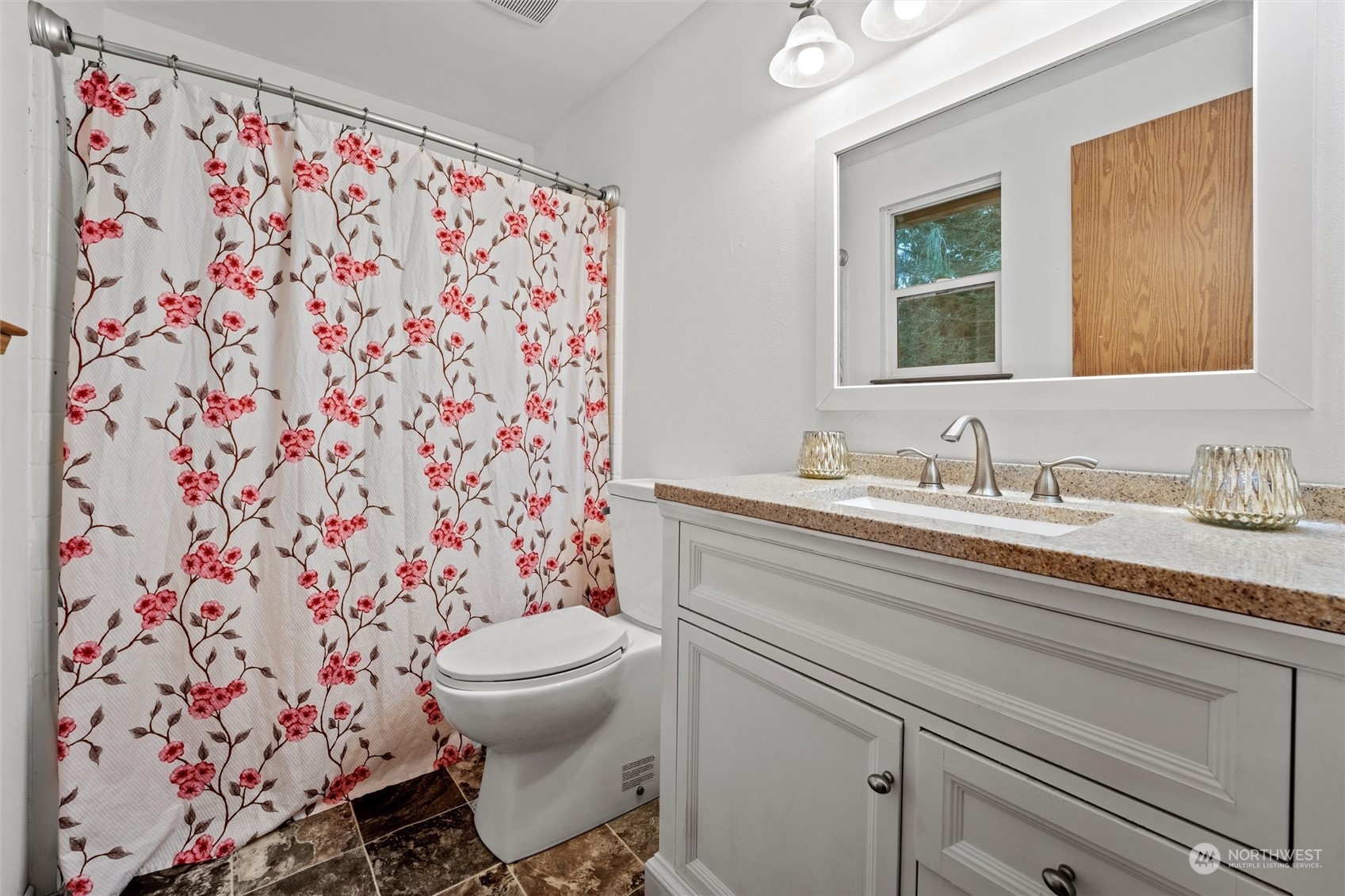 4574 Knute Anderson Road Northwest Silverdale, WA 98383 - Photo 17 of 39 a bathroom with a granite countertop sink a toilet and a mirror