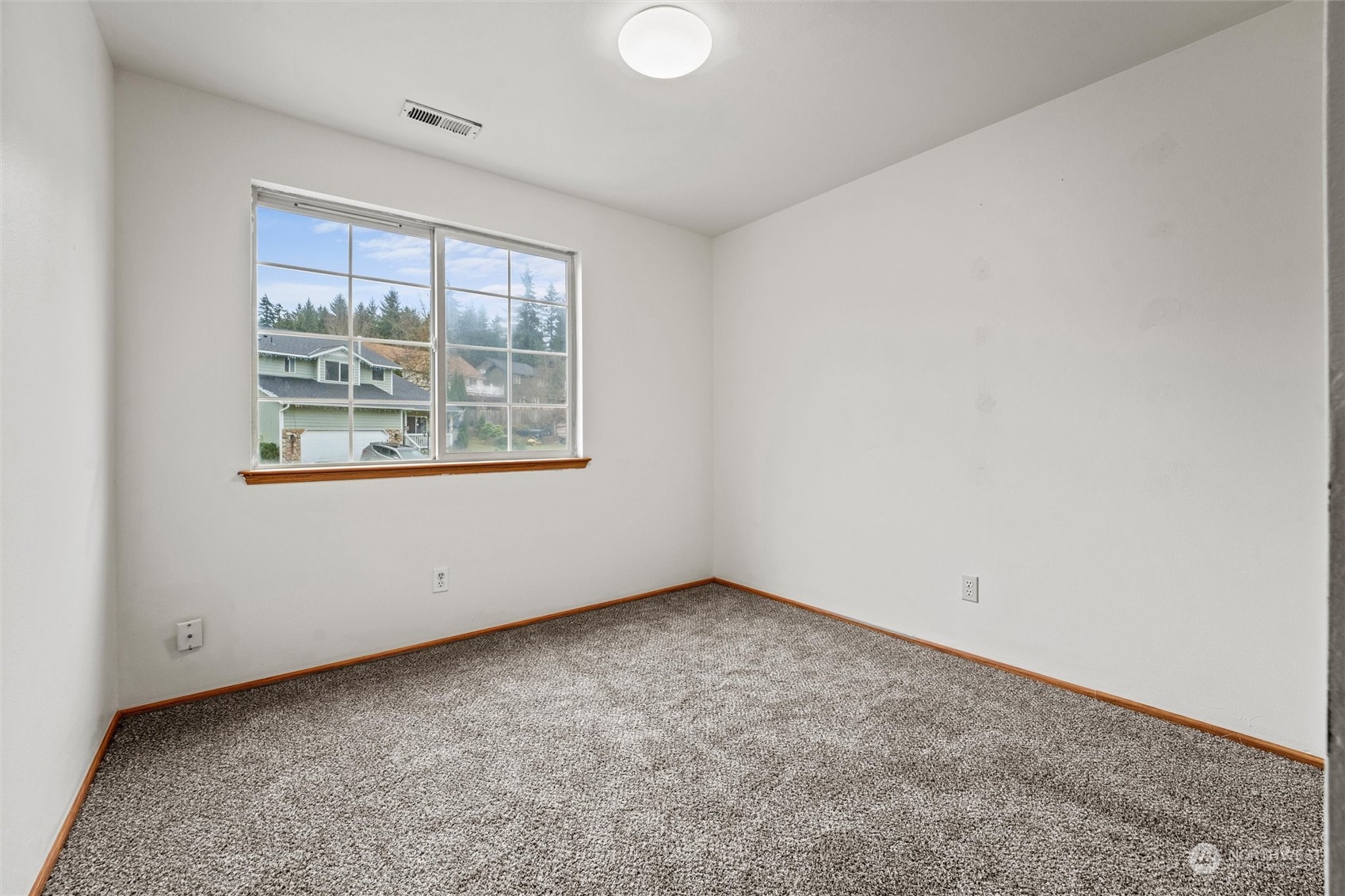 4574 Knute Anderson Road Northwest Silverdale, WA 98383 - Photo 18 of 39 an empty room with a window