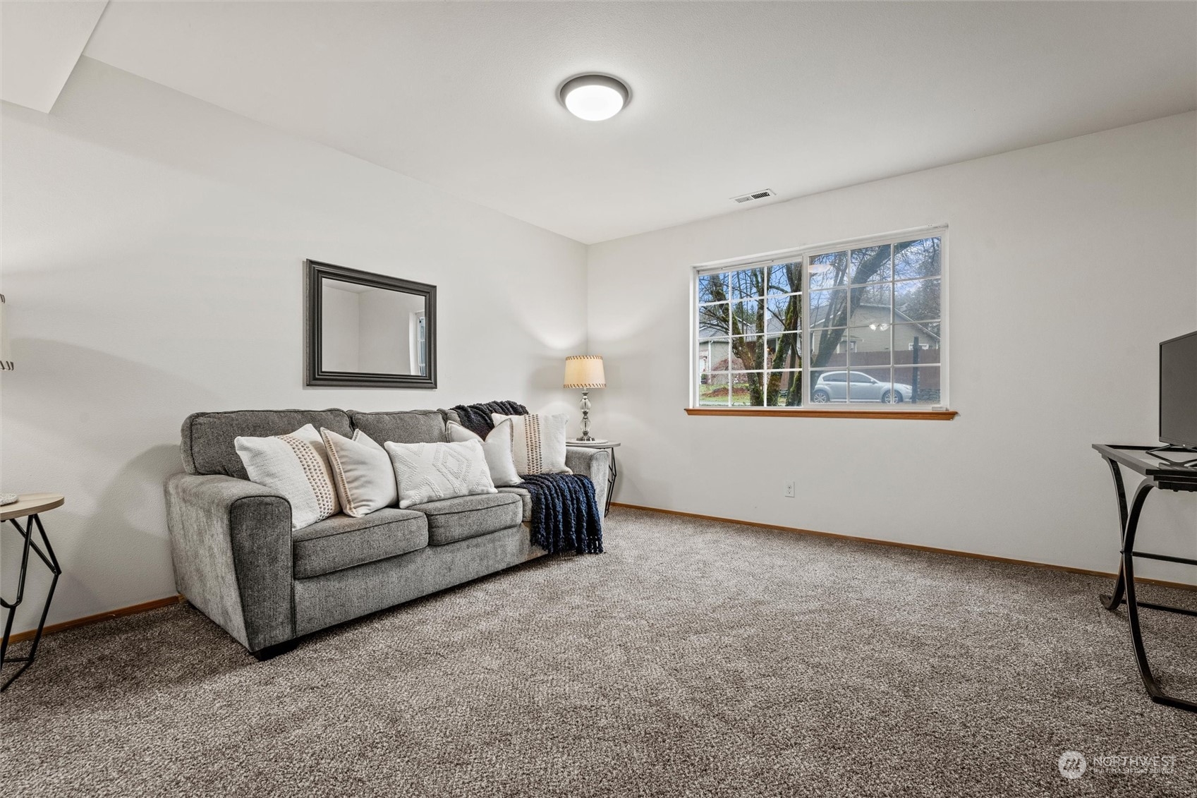 4574 Knute Anderson Road Northwest Silverdale, WA 98383 - Photo 25 of 39 a living room with furniture and a window