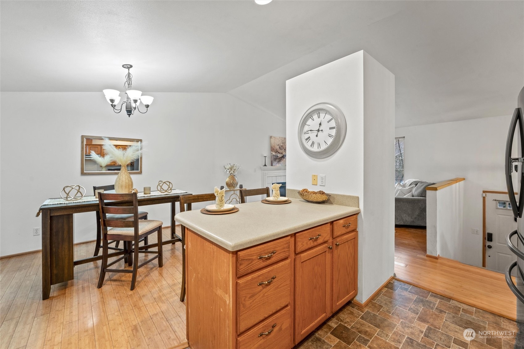 4574 Knute Anderson Road Northwest Silverdale, WA 98383 - Photo 31 of 39 a view of a kitchen area with furniture and wooden floor