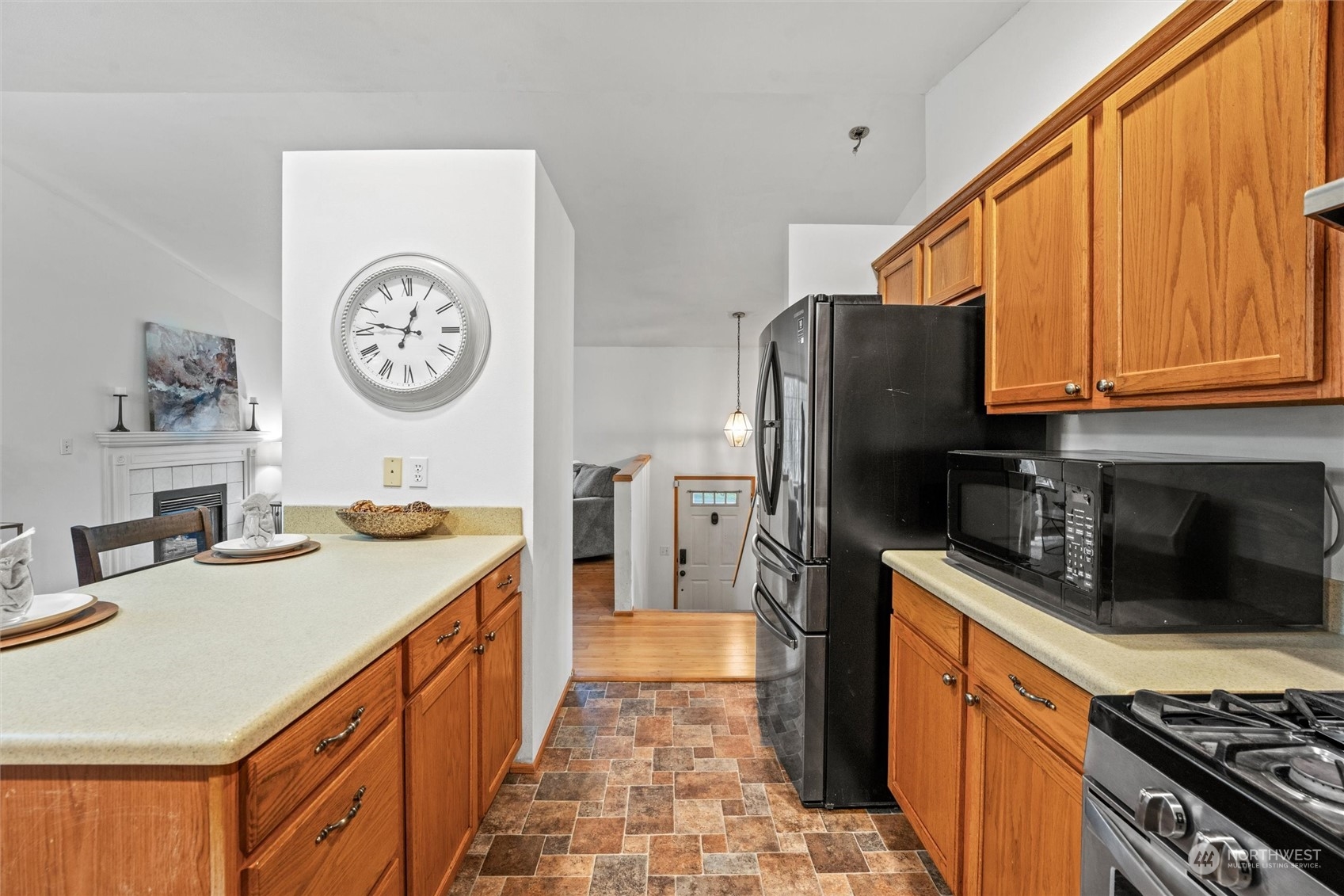 4574 Knute Anderson Road Northwest Silverdale, WA 98383 - Photo 32 of 39 a kitchen with stainless steel appliances granite countertop a sink stove and refrigerator