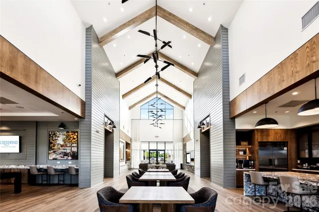 a large room with lots of furniture and a large window