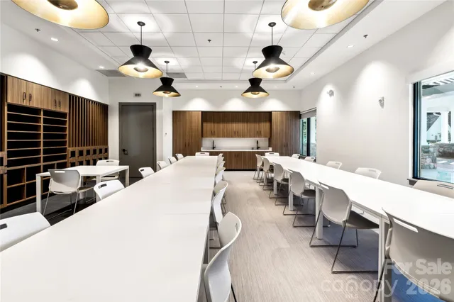 a kitchen with stainless steel appliances granite countertop a stove a sink dishwasher and a black countertops with cabinets