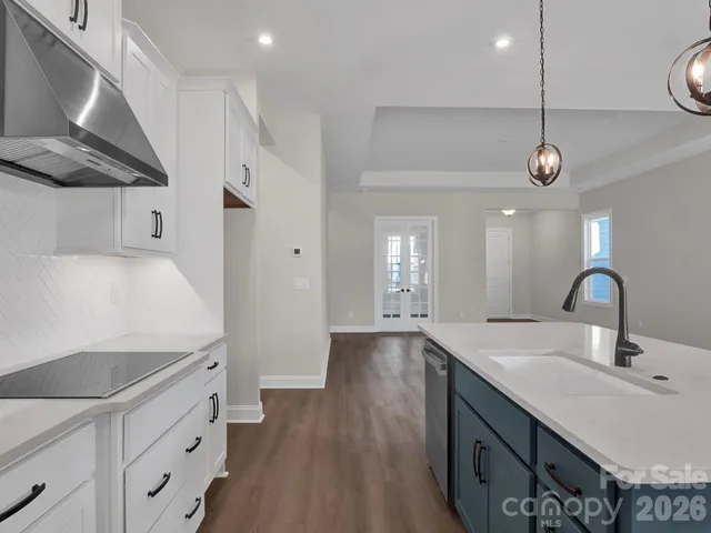 a kitchen with a sink and a refrigerator