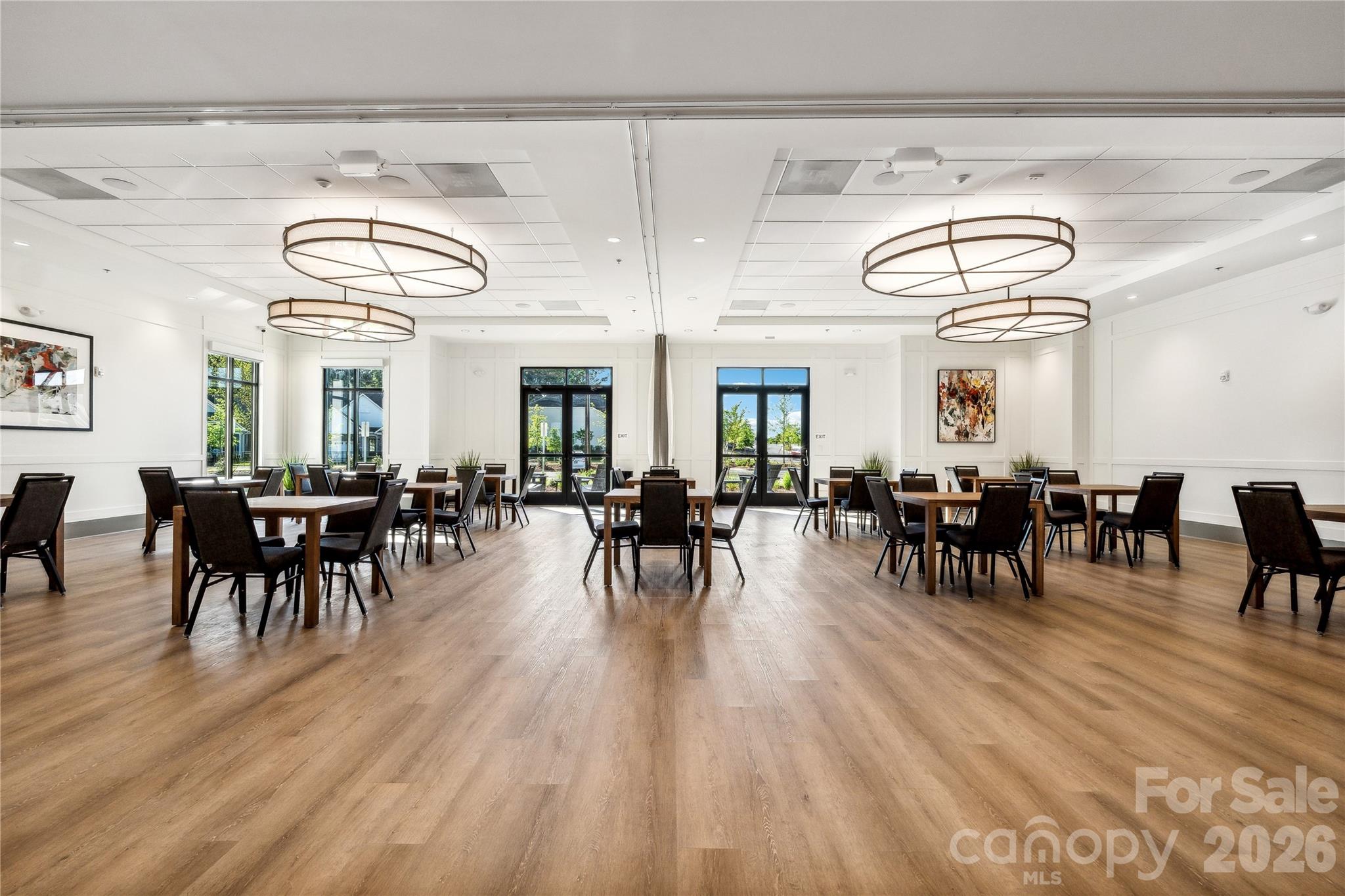3031 Lake Como Drive Monroe, NC 28110 - Photo 32 of 39 a view of a dining room with furniture window and wooden floor
