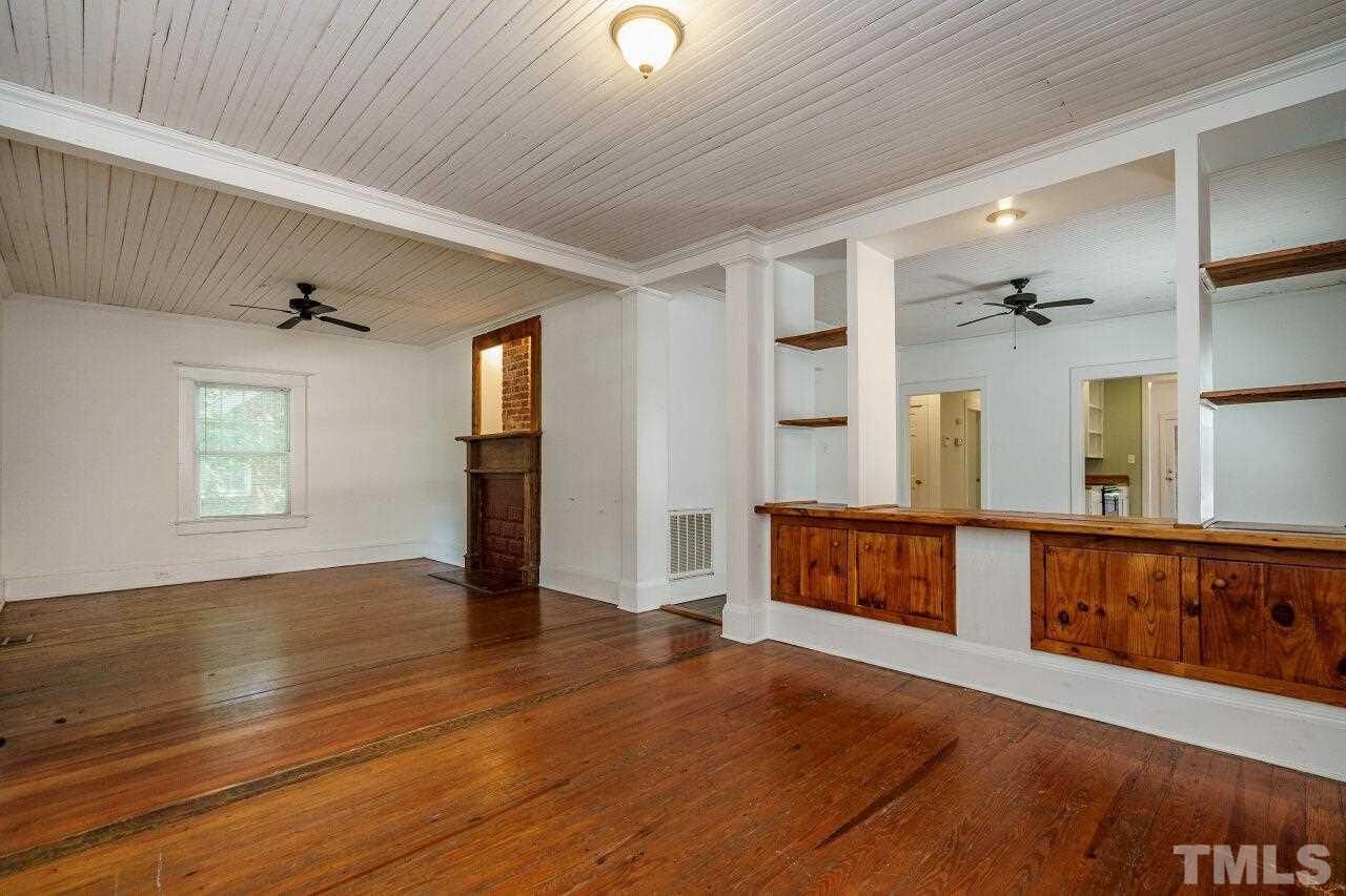 105 East Whitaker Mill Road Raleigh, NC 27608 - Photo 7 of 21 a view of an entryway with wooden floor