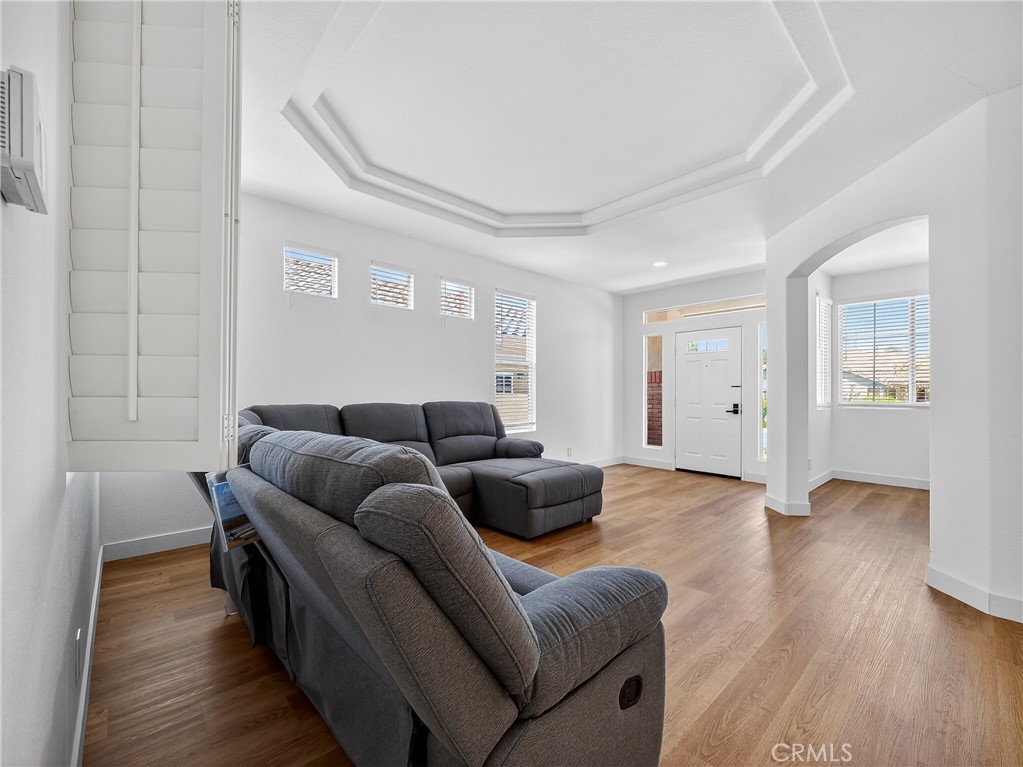 1436 Riviera Avenue Banning, CA 92220 - Photo 25 of 43 a living room with furniture and wooden floor