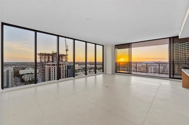 a kitchen with stainless steel appliances granite countertop a sink and white cabinets