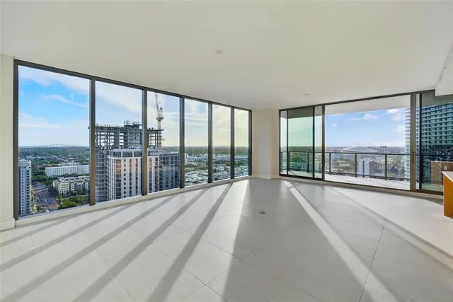 a kitchen with stainless steel appliances granite countertop a sink and a white cabinets