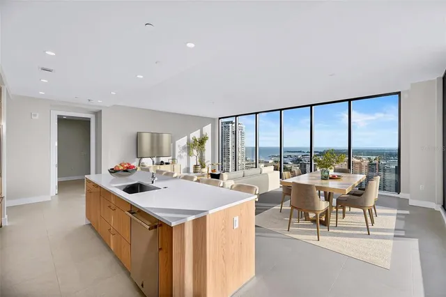 a bathroom with a shower sink vanity mirror and toilet