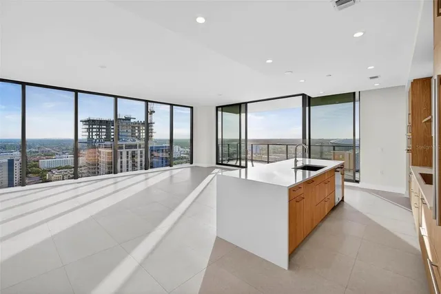 a bathroom with a shower and a sink